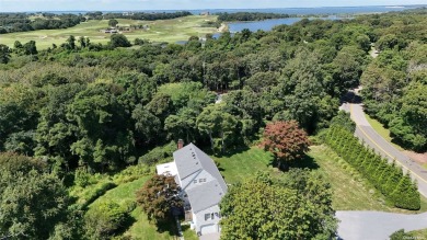 Spacious home with a large living room featuring a wood-burning on National Golf Links of America in New York - for sale on GolfHomes.com, golf home, golf lot