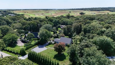 Spacious home with a large living room featuring a wood-burning on National Golf Links of America in New York - for sale on GolfHomes.com, golf home, golf lot