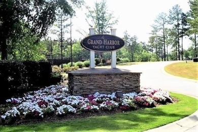 Lakefront luxury waits for you inside the exclusive Grand Harbor on The Patriot Golf Club At Grand Harbor in South Carolina - for sale on GolfHomes.com, golf home, golf lot