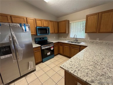 This beautifully renovated home in Citrus Springs boasts a range on Citrus Springs Country Club in Florida - for sale on GolfHomes.com, golf home, golf lot