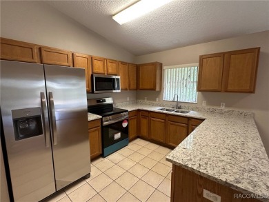 This beautifully renovated home in Citrus Springs boasts a range on Citrus Springs Country Club in Florida - for sale on GolfHomes.com, golf home, golf lot