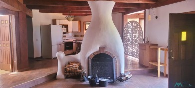 This Santa Fe style home is absolutely charming and rich in on Sierra Del Rio Golf Club in New Mexico - for sale on GolfHomes.com, golf home, golf lot