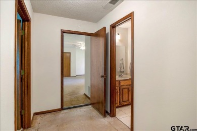 Discover the potential in this 3 bedroom, 2 bath home tucked on Hide-A-Way Lake Golf Course in Texas - for sale on GolfHomes.com, golf home, golf lot