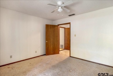 Discover the potential in this 3 bedroom, 2 bath home tucked on Hide-A-Way Lake Golf Course in Texas - for sale on GolfHomes.com, golf home, golf lot