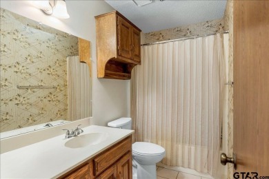 Discover the potential in this 3 bedroom, 2 bath home tucked on Hide-A-Way Lake Golf Course in Texas - for sale on GolfHomes.com, golf home, golf lot