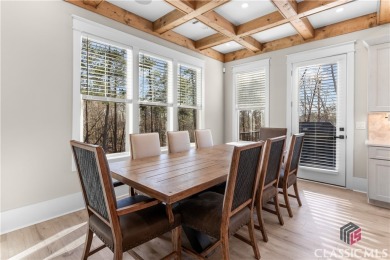 Discover the epitome of luxury living in this exquisite estate on Reynolds Lake Oconee - The Oconee in Georgia - for sale on GolfHomes.com, golf home, golf lot