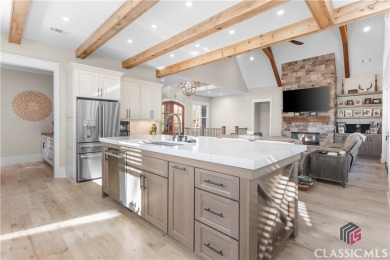 Discover the epitome of luxury living in this exquisite estate on Reynolds Lake Oconee - The Oconee in Georgia - for sale on GolfHomes.com, golf home, golf lot