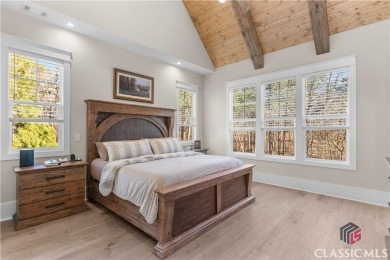 Discover the epitome of luxury living in this exquisite estate on Reynolds Lake Oconee - The Oconee in Georgia - for sale on GolfHomes.com, golf home, golf lot