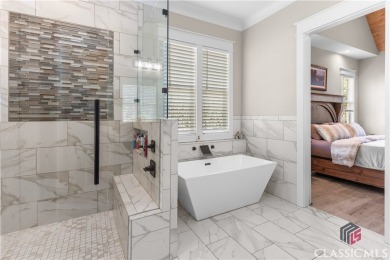 Discover the epitome of luxury living in this exquisite estate on Reynolds Lake Oconee - The Oconee in Georgia - for sale on GolfHomes.com, golf home, golf lot