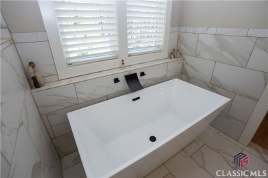Discover the epitome of luxury living in this exquisite estate on Reynolds Lake Oconee - The Oconee in Georgia - for sale on GolfHomes.com, golf home, golf lot