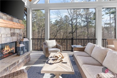 Discover the epitome of luxury living in this exquisite estate on Reynolds Lake Oconee - The Oconee in Georgia - for sale on GolfHomes.com, golf home, golf lot