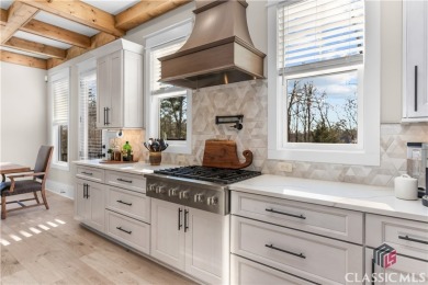 Discover the epitome of luxury living in this exquisite estate on Reynolds Lake Oconee - The Oconee in Georgia - for sale on GolfHomes.com, golf home, golf lot