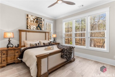 Discover the epitome of luxury living in this exquisite estate on Reynolds Lake Oconee - The Oconee in Georgia - for sale on GolfHomes.com, golf home, golf lot
