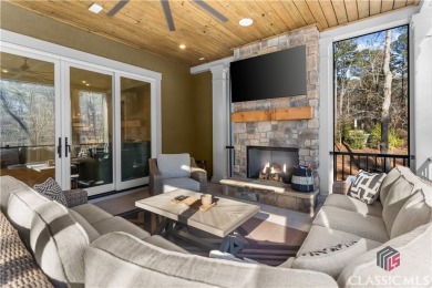 Discover the epitome of luxury living in this exquisite estate on Reynolds Lake Oconee - The Oconee in Georgia - for sale on GolfHomes.com, golf home, golf lot