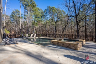 Discover the epitome of luxury living in this exquisite estate on Reynolds Lake Oconee - The Oconee in Georgia - for sale on GolfHomes.com, golf home, golf lot