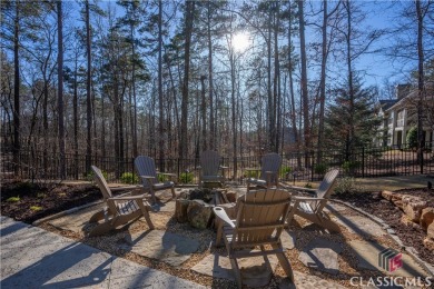 Discover the epitome of luxury living in this exquisite estate on Reynolds Lake Oconee - The Oconee in Georgia - for sale on GolfHomes.com, golf home, golf lot