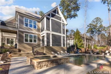 Discover the epitome of luxury living in this exquisite estate on Reynolds Lake Oconee - The Oconee in Georgia - for sale on GolfHomes.com, golf home, golf lot