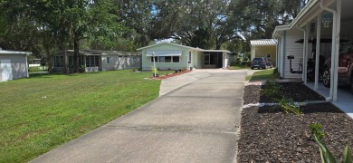 Tucked-Away Treasure - Updated & Move-In Ready for Just $50,000! on Rolling Greens Executive Golf Community in Florida - for sale on GolfHomes.com, golf home, golf lot