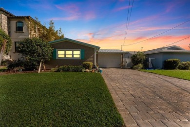 Discover unparalleled waterfront living with expansive views of on Mangrove Bay Golf Course in Florida - for sale on GolfHomes.com, golf home, golf lot