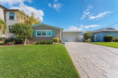 Discover unparalleled waterfront living with expansive views of on Mangrove Bay Golf Course in Florida - for sale on GolfHomes.com, golf home, golf lot