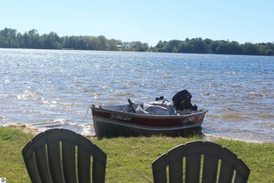 This beautifully maintained and updated home has 400 ft of on Elk Rapids Golf Club in Michigan - for sale on GolfHomes.com, golf home, golf lot