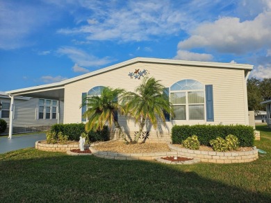 This garage is 32 feet by 22 feet, 2 separate doors, a 12-foot on Southport Springs Golf Club in Florida - for sale on GolfHomes.com, golf home, golf lot