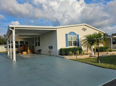 This garage is 32 feet by 22 feet, 2 separate doors, a 12-foot on Southport Springs Golf Club in Florida - for sale on GolfHomes.com, golf home, golf lot