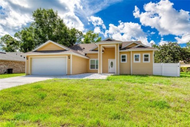 This newly remodeled 3-bedroom, 3-bathroom home in the desirable on The Grand Club - Pine Lakes Course in Florida - for sale on GolfHomes.com, golf home, golf lot