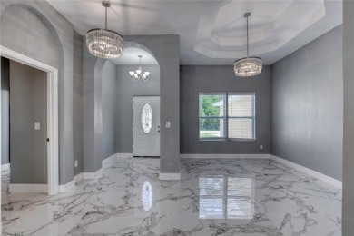 This newly remodeled 3-bedroom, 3-bathroom home in the desirable on The Grand Club - Pine Lakes Course in Florida - for sale on GolfHomes.com, golf home, golf lot