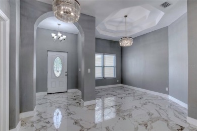 This newly remodeled 3-bedroom, 3-bathroom home in the desirable on The Grand Club - Pine Lakes Course in Florida - for sale on GolfHomes.com, golf home, golf lot