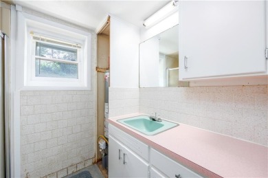 Tucked at the end of a quiet looped road, this 3-bedroom, 1 on Independence Country Club in Kansas - for sale on GolfHomes.com, golf home, golf lot