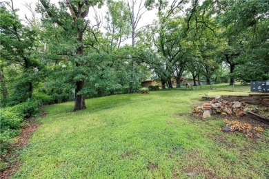 Tucked at the end of a quiet looped road, this 3-bedroom, 1 on Independence Country Club in Kansas - for sale on GolfHomes.com, golf home, golf lot