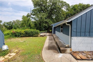 Tucked at the end of a quiet looped road, this 3-bedroom, 1 on Independence Country Club in Kansas - for sale on GolfHomes.com, golf home, golf lot