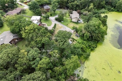Tucked at the end of a quiet looped road, this 3-bedroom, 1 on Independence Country Club in Kansas - for sale on GolfHomes.com, golf home, golf lot