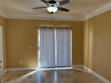 This spacious condo has updraded travertine tile throughout on Gateway Golf and Country Club in Florida - for sale on GolfHomes.com, golf home, golf lot