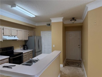 This spacious condo has updraded travertine tile throughout on Gateway Golf and Country Club in Florida - for sale on GolfHomes.com, golf home, golf lot
