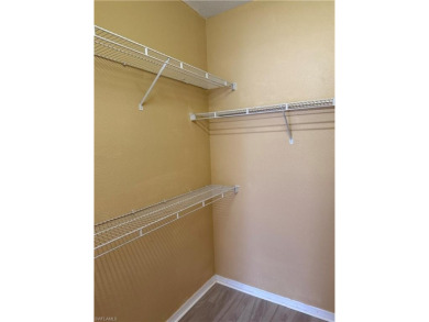 This spacious condo has updraded travertine tile throughout on Gateway Golf and Country Club in Florida - for sale on GolfHomes.com, golf home, golf lot
