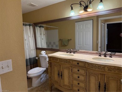This spacious condo has updraded travertine tile throughout on Gateway Golf and Country Club in Florida - for sale on GolfHomes.com, golf home, golf lot