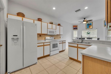 Presenting a well-maintained 2-bedroom, 2-bathroom home with an on Lake Ashton Golf Club in Florida - for sale on GolfHomes.com, golf home, golf lot