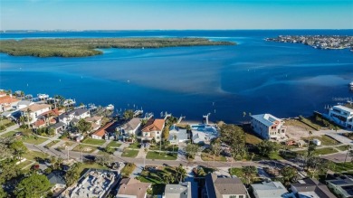 Discover unparalleled waterfront living with expansive views of on Mangrove Bay Golf Course in Florida - for sale on GolfHomes.com, golf home, golf lot