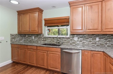 Lovely CBS 3 bedroom, 2 bath, 2 car garage split plan home with on Martin Downs Country Club in Florida - for sale on GolfHomes.com, golf home, golf lot