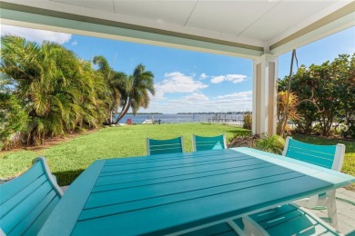 Discover unparalleled waterfront living with expansive views of on Mangrove Bay Golf Course in Florida - for sale on GolfHomes.com, golf home, golf lot