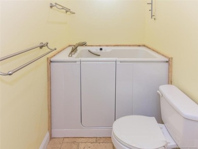 Lovely CBS 3 bedroom, 2 bath, 2 car garage split plan home with on Martin Downs Country Club in Florida - for sale on GolfHomes.com, golf home, golf lot