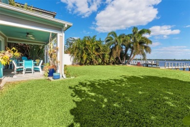 Discover unparalleled waterfront living with expansive views of on Mangrove Bay Golf Course in Florida - for sale on GolfHomes.com, golf home, golf lot