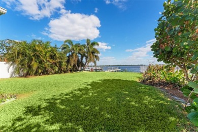 Discover unparalleled waterfront living with expansive views of on Mangrove Bay Golf Course in Florida - for sale on GolfHomes.com, golf home, golf lot