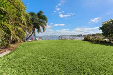 Discover unparalleled waterfront living with expansive views of on Mangrove Bay Golf Course in Florida - for sale on GolfHomes.com, golf home, golf lot