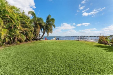 Discover unparalleled waterfront living with expansive views of on Mangrove Bay Golf Course in Florida - for sale on GolfHomes.com, golf home, golf lot