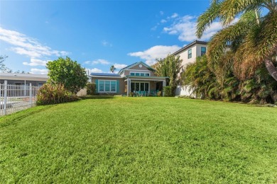 Discover unparalleled waterfront living with expansive views of on Mangrove Bay Golf Course in Florida - for sale on GolfHomes.com, golf home, golf lot