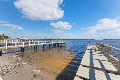 Discover unparalleled waterfront living with expansive views of on Mangrove Bay Golf Course in Florida - for sale on GolfHomes.com, golf home, golf lot