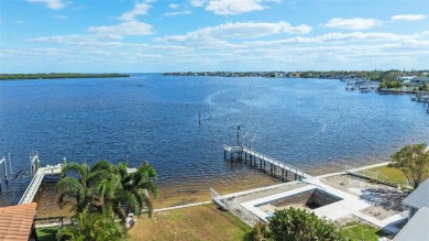 Discover unparalleled waterfront living with expansive views of on Mangrove Bay Golf Course in Florida - for sale on GolfHomes.com, golf home, golf lot